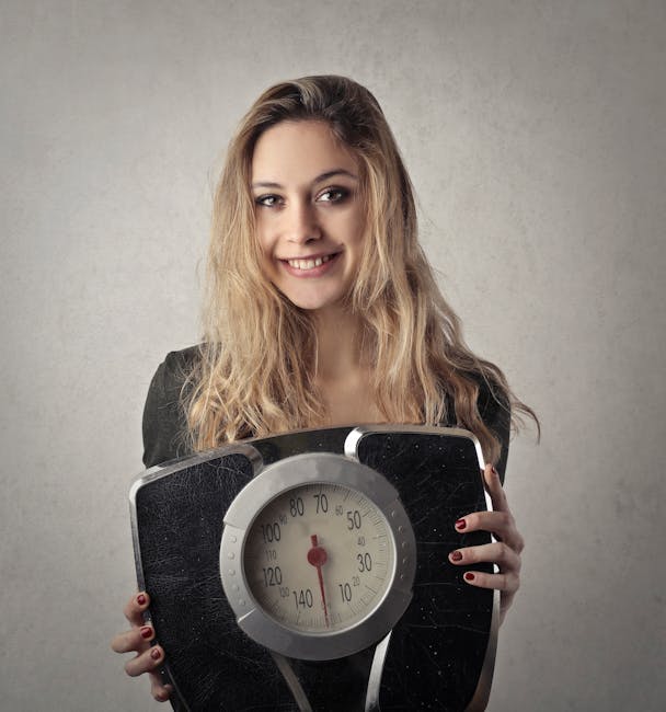 Young woman with blond hair smiling, holding a vintage bathroom scale indoors.